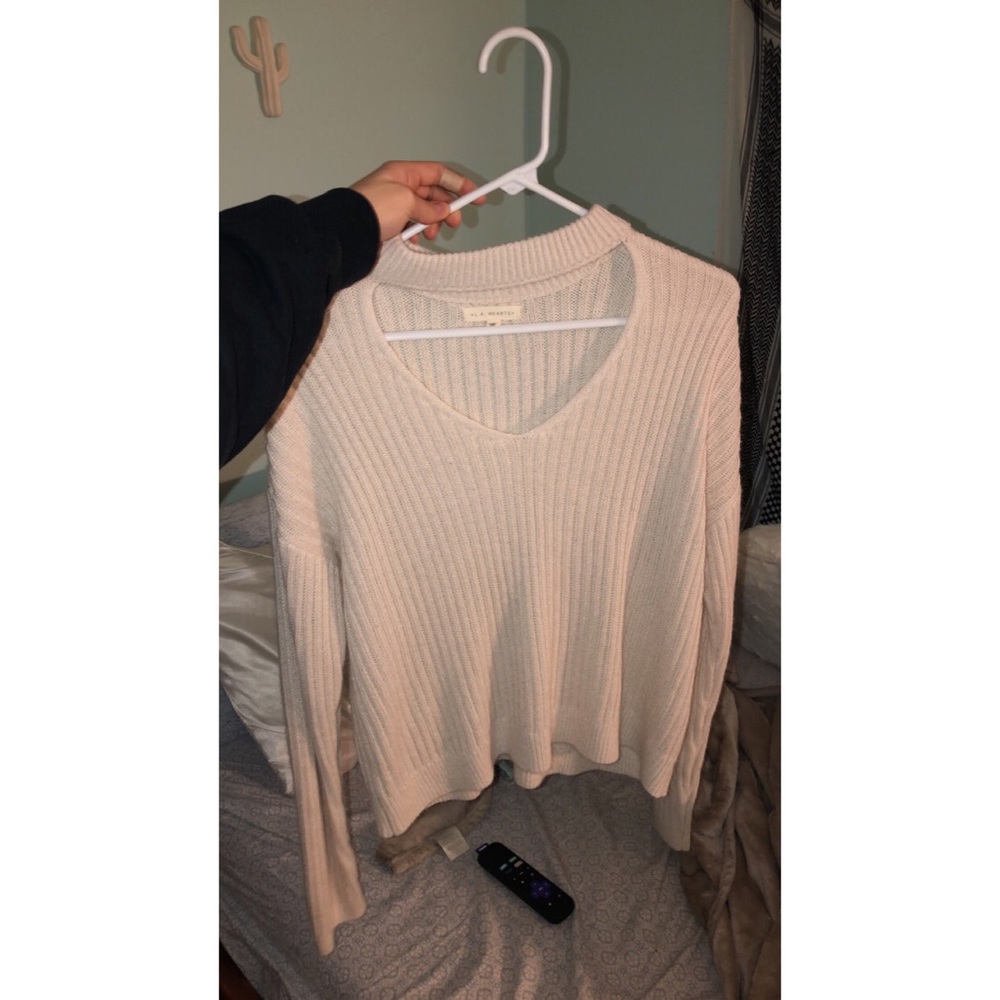 WHITE/CREME V NECK CUT OUT SWEATER from LA hearts